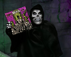 Hooded action figure with a skull face holding Misfits album cover, Ultimate Fiend Clothed