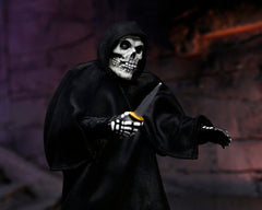 Skeletal figure in black robe holds orange object from Ultimate Fiend Clothed Action Figure