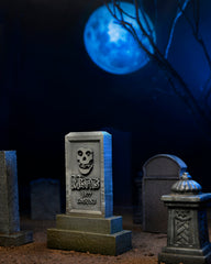 Tombstone-shaped object with skull logo and Misfits text for Ultimate Fiend Clothed Action Figure