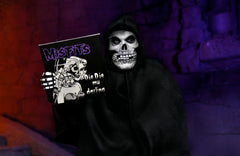 Hooded figure with skull face holding Misfits album in Ultimate Fiend clothed action figure