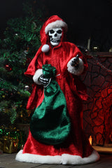 Skeleton as Santa Claus with a green gift bag in Misfits Holiday Fiend action figure