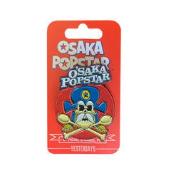 Enamel pin of cartoon skull with blue hat in Osaka Popstar vinyl bundle design