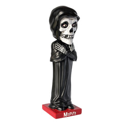Skeleton figurine in black robe and cap on red base labeled Misfits Fiend Limited Edition