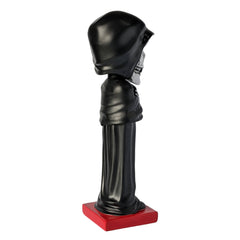 Black skull-shaped figurine on red base from Misfits Fiend Limited Edition Throbblehead